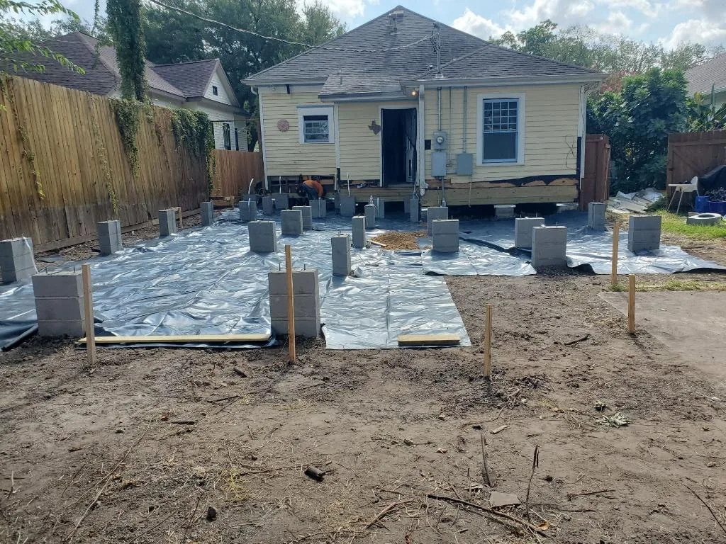 Foundation work behind the Columbia Street home